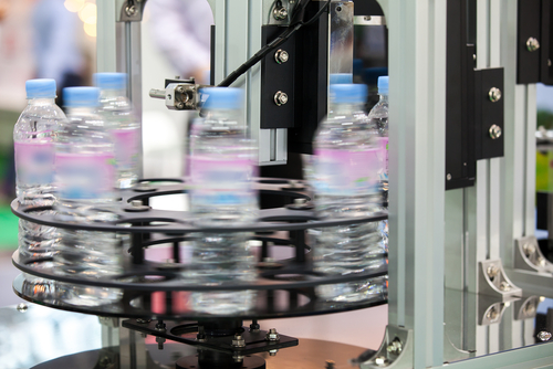 Water Bottles being labelled at high speed