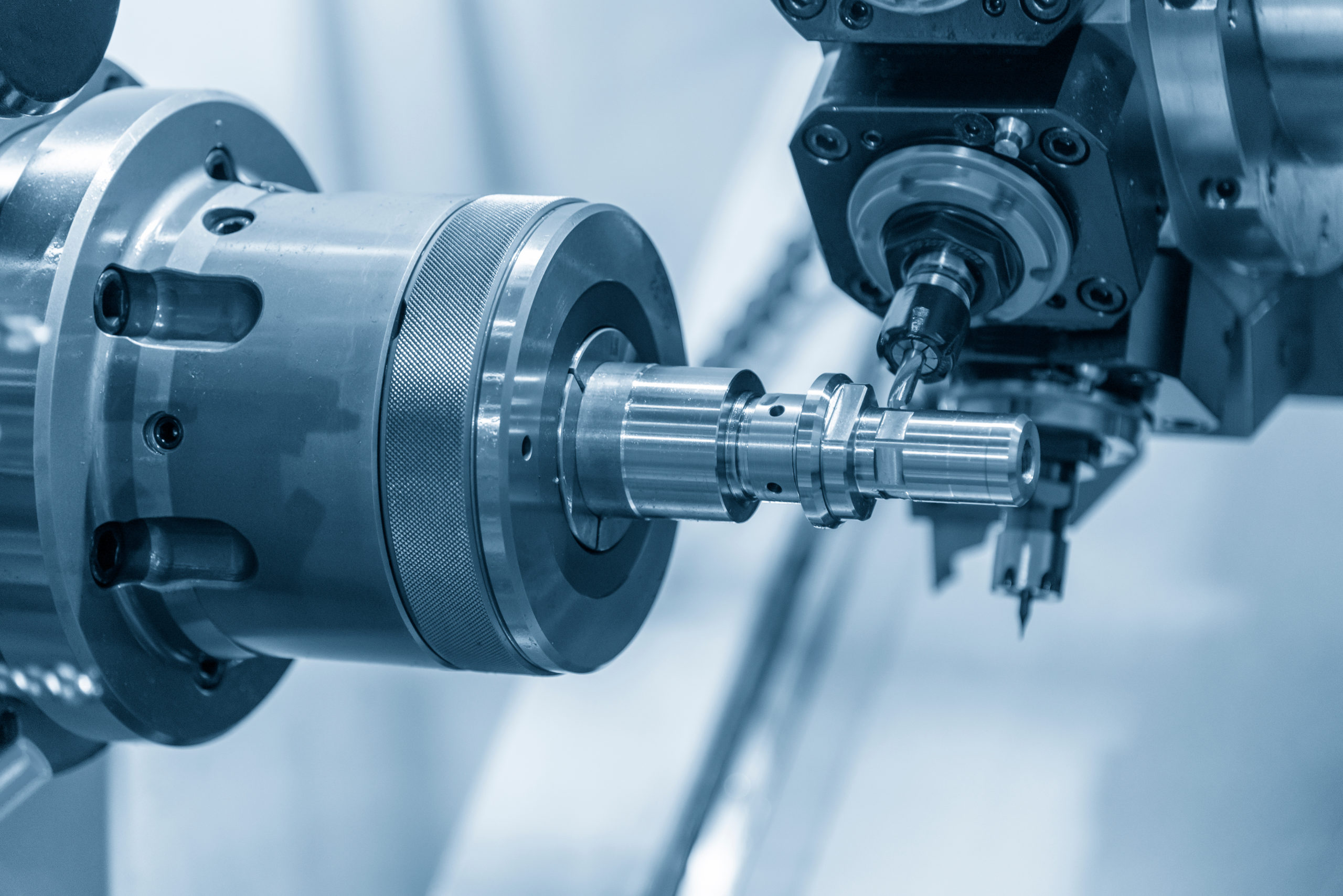 Image of a CNC lathe machining a part.