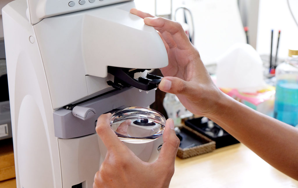 Person polishing a lens