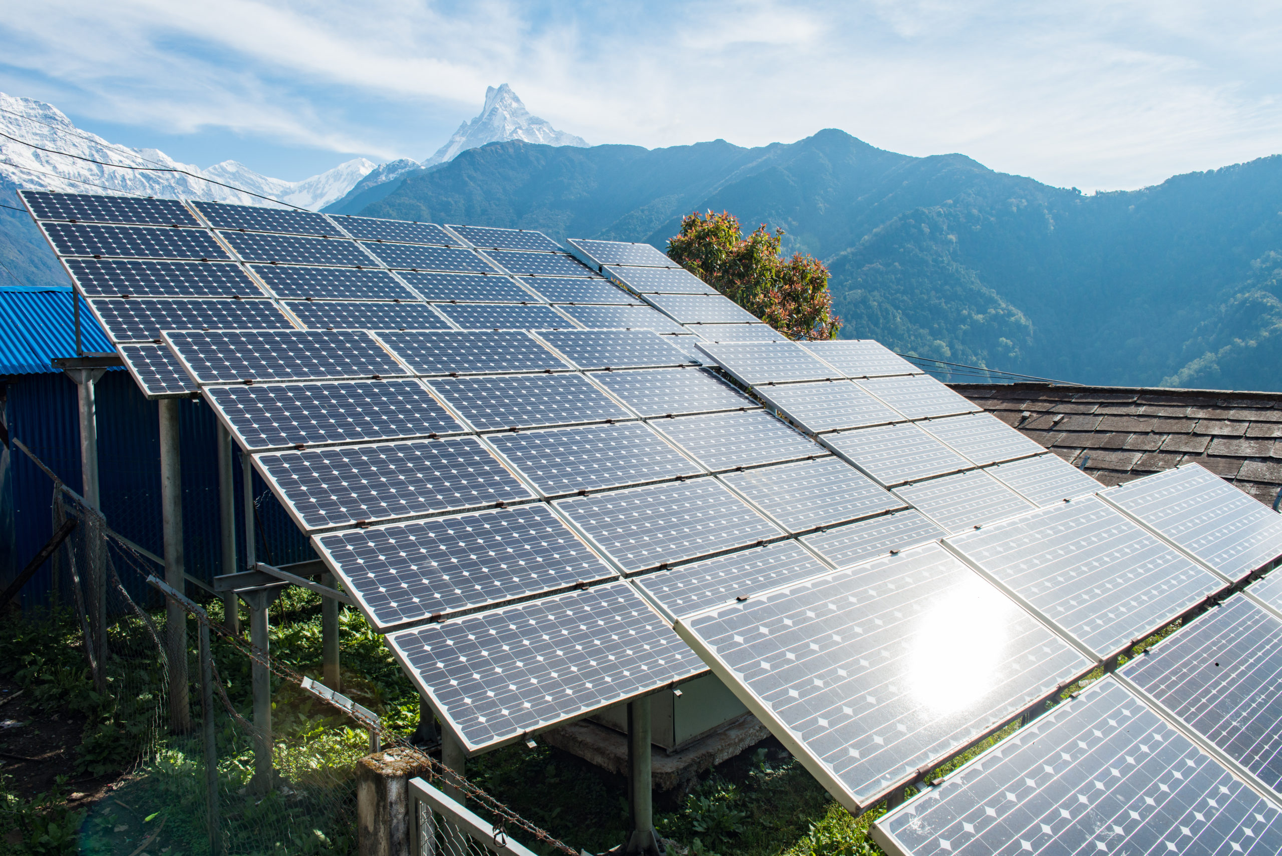 Solar cell panels installation on the high mountains in Annapurna sanctuary of Nepal with Machapuchare mountain at the background