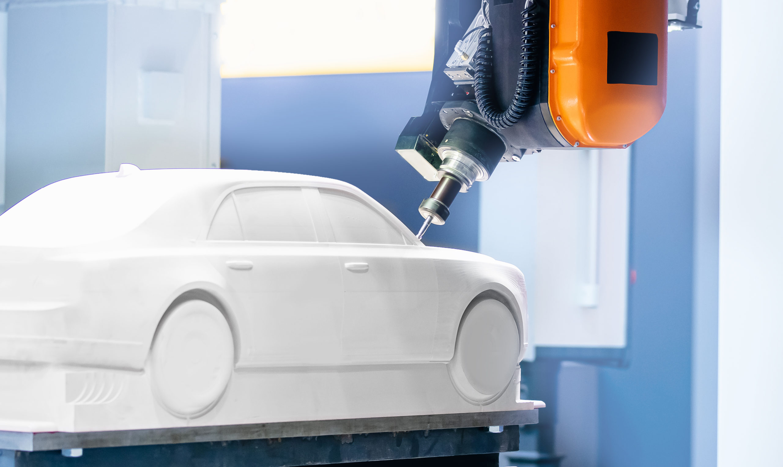 Robot-controlled cnc arm carving rapid prototype of automotive model for testing