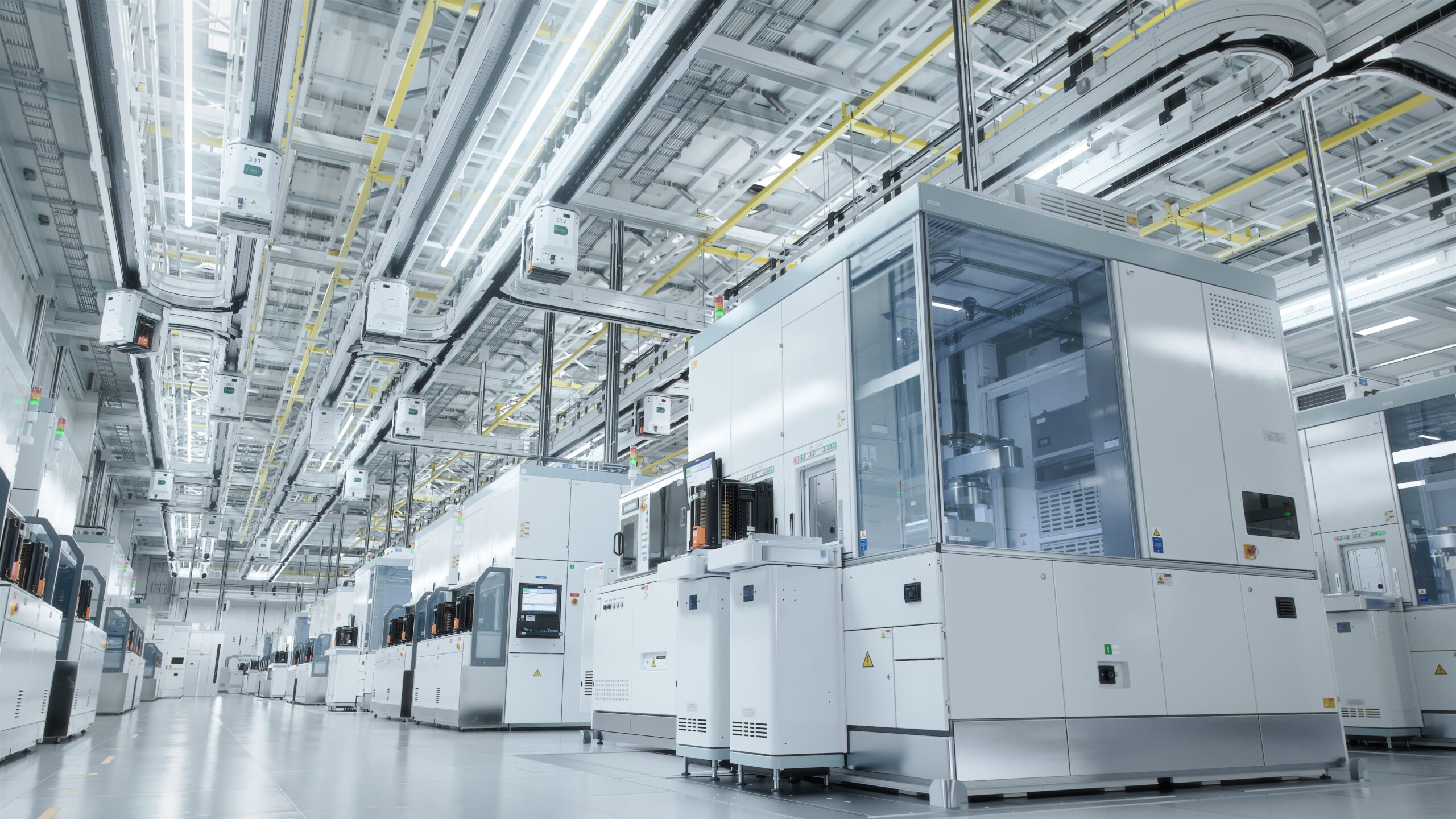 Bright interior of modern semiconductor production facility utilizing linear slide technology